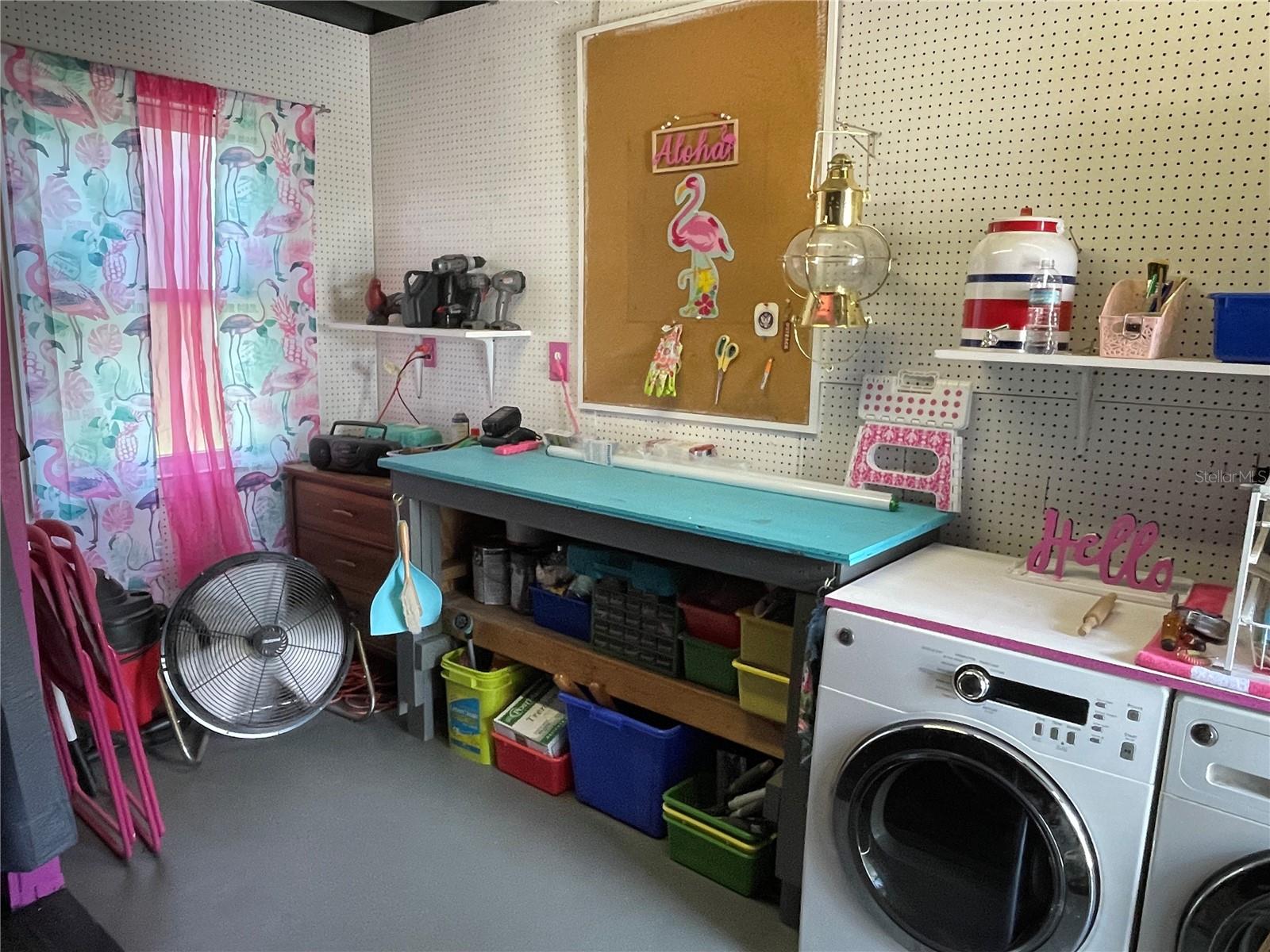 Laundry room next to garage