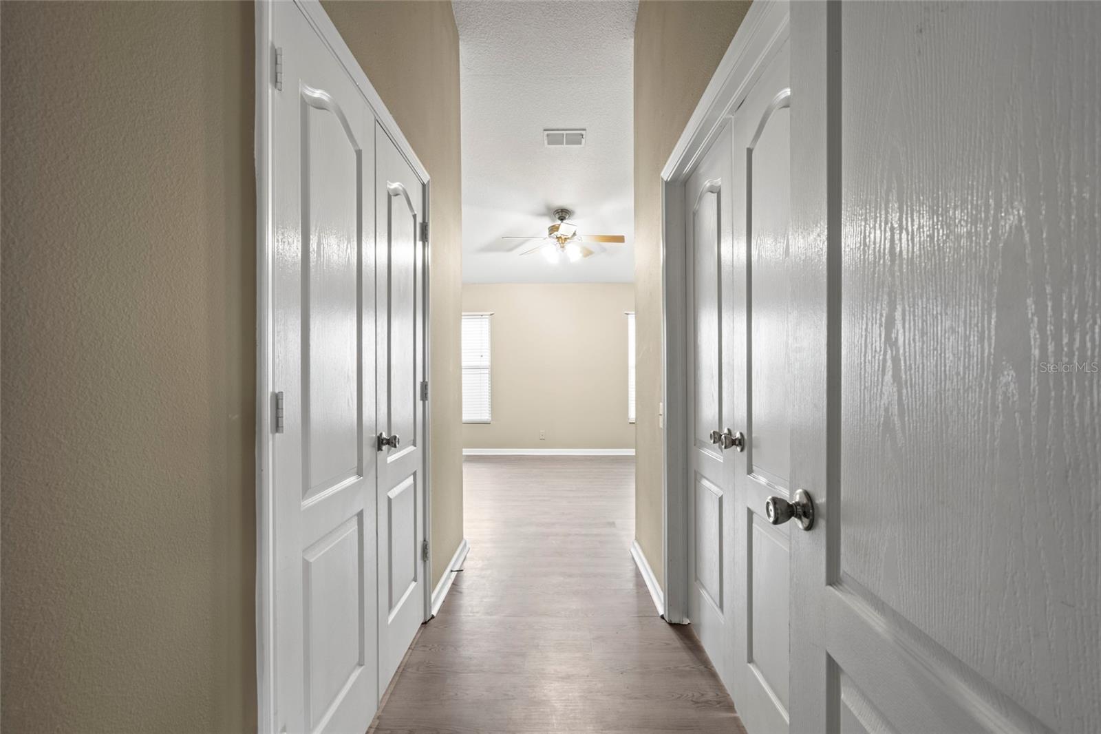 Master Bedroom Entrance with VAULTED CEILINGS. Master bath on the left & Master closet on the right.