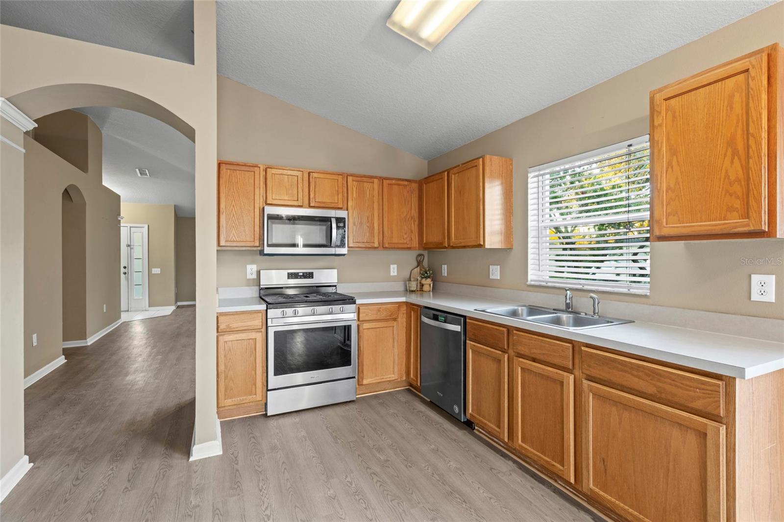 Kitchen with stainless steel GAS Range, Microwave and Dishwasher