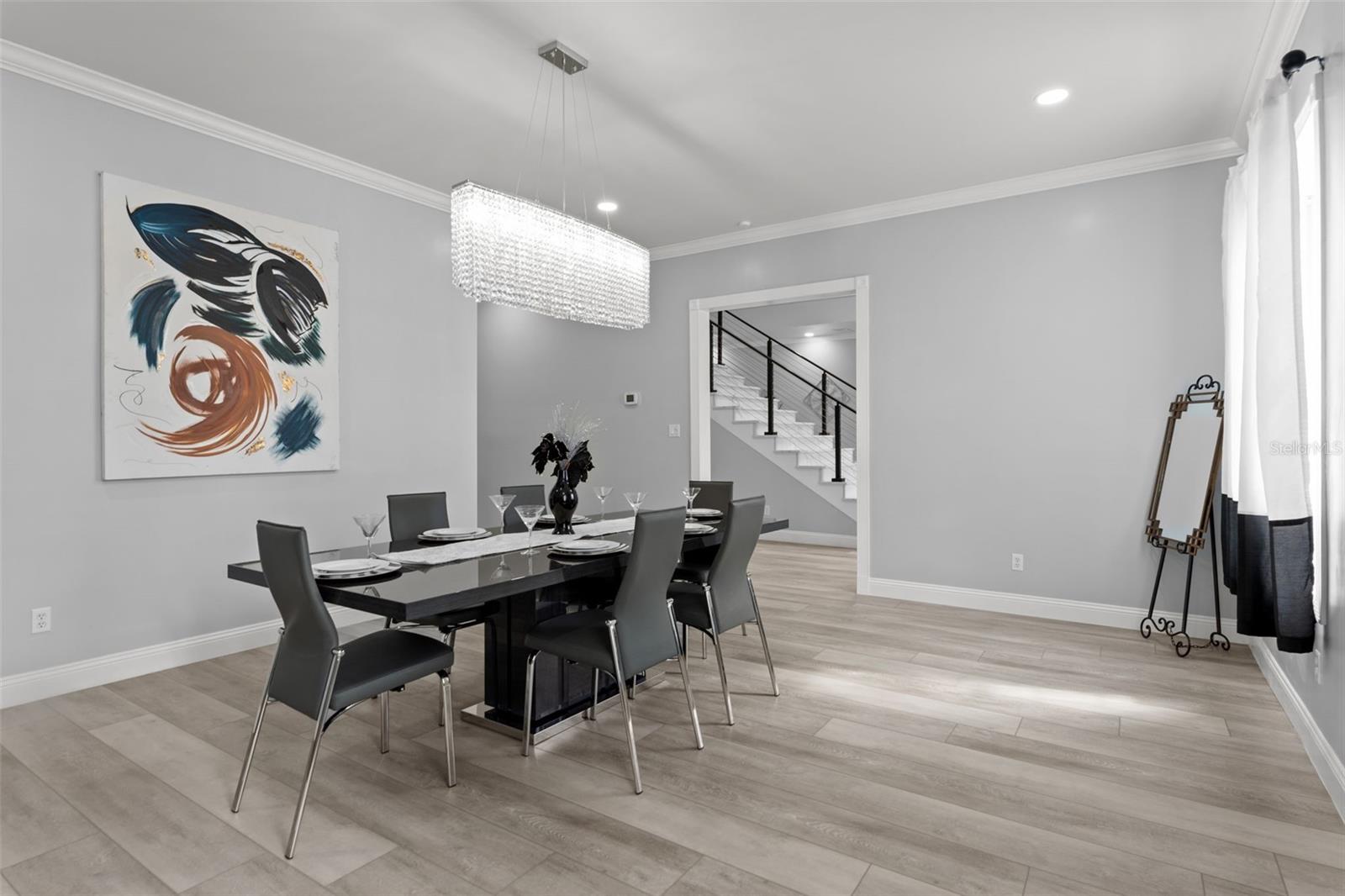 Formal Dining Room Crowned by an Exquisite Chandelier