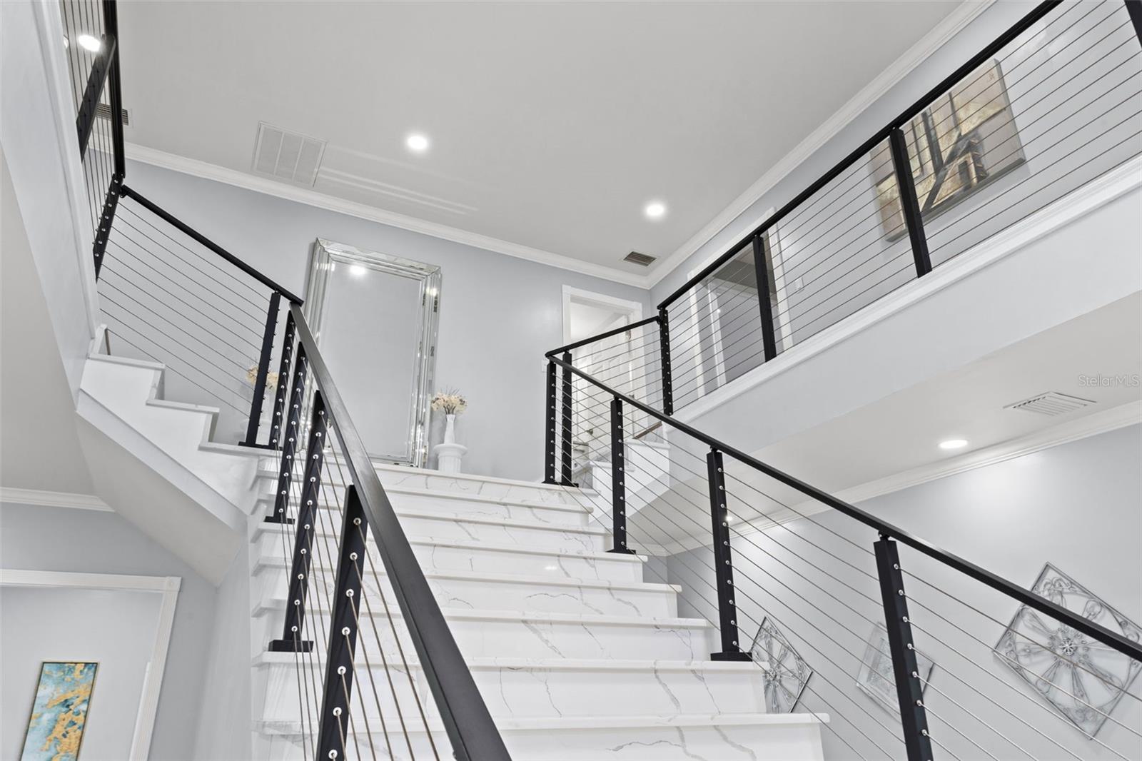 Grand Entryway & Majestic 2 Story Foyer with custom quartz staircase with modern cable railing