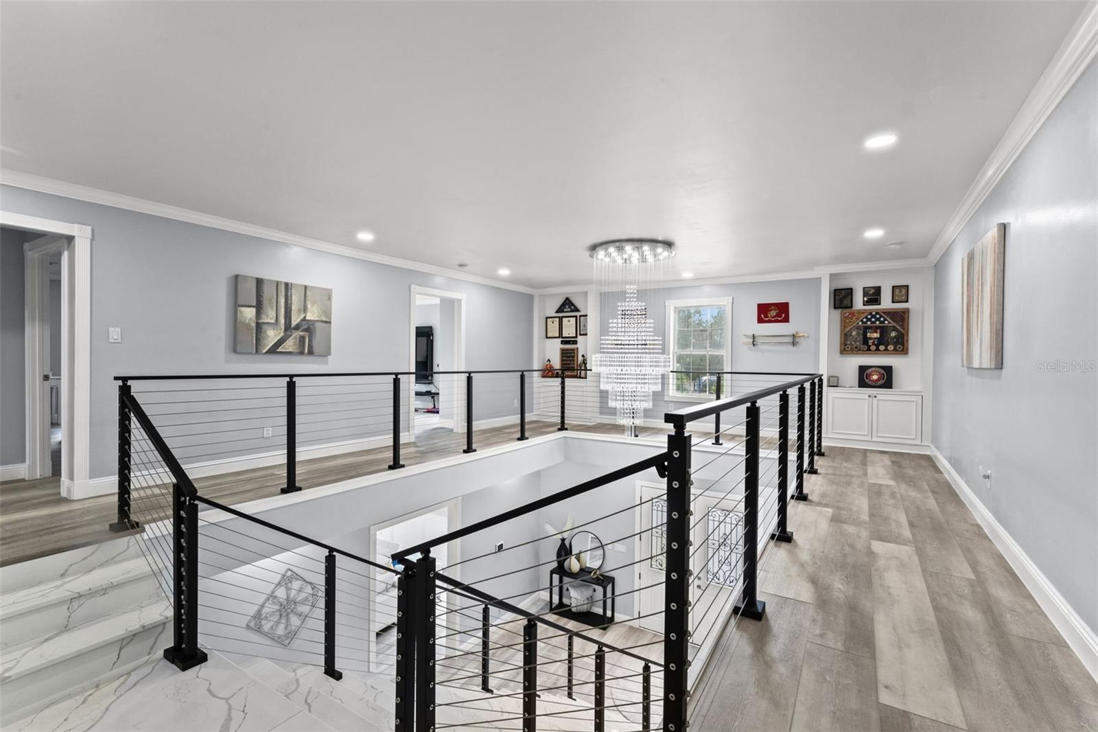 2nd Floor Foyer with custom quartz staircase with modern cable railing