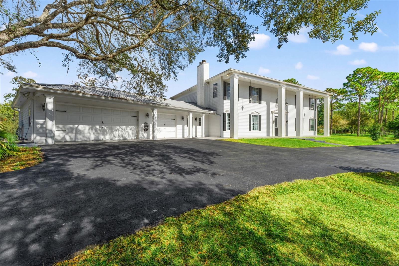 Colonial-inspired estate, designed with the grandeur reminiscent of the iconic “White House.” Set on a private 2.40-acre property