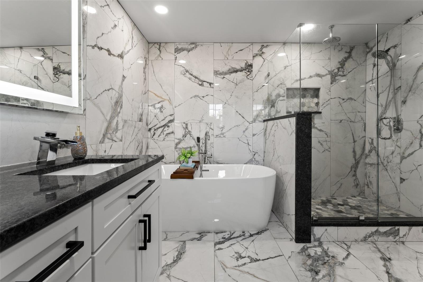 Spa-Like Master Ensuite with Dual Vanities, a Rainfall Shower, and a Garden Tub.