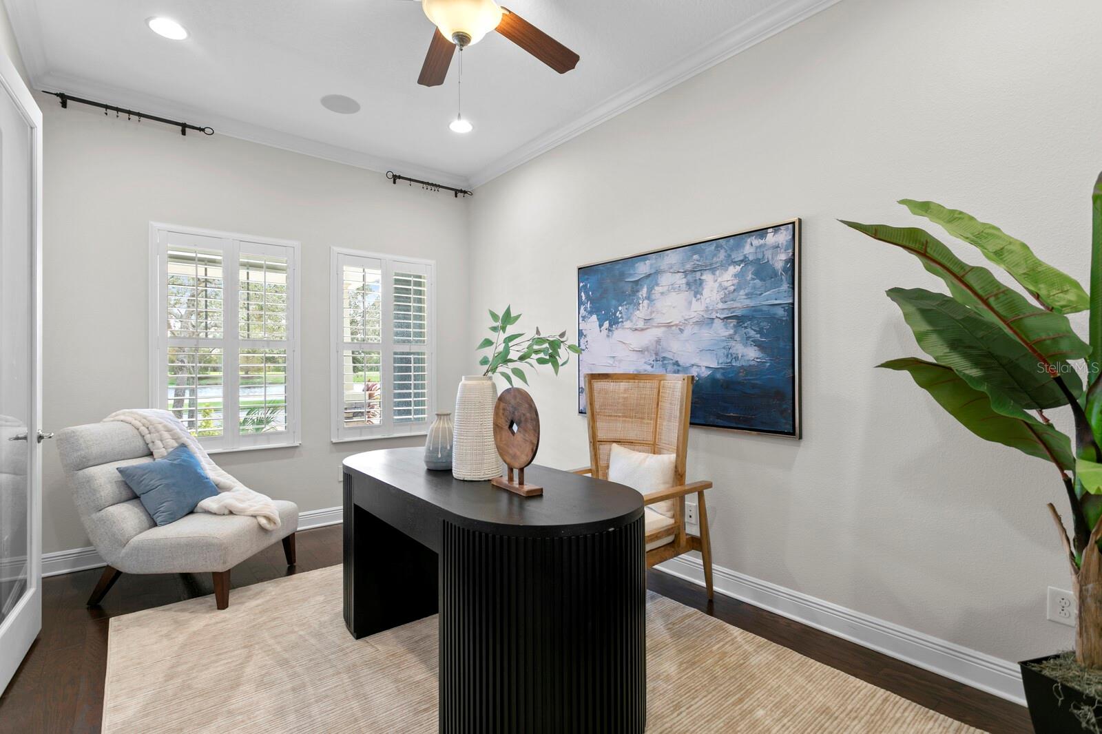 French doors lead to the 5th bedroom that is currently being used as a home office