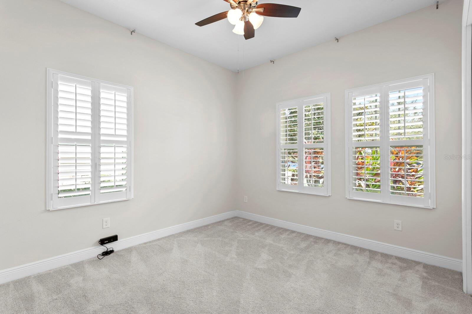 This bedroom is located at the front of the home and has fantastic natural light