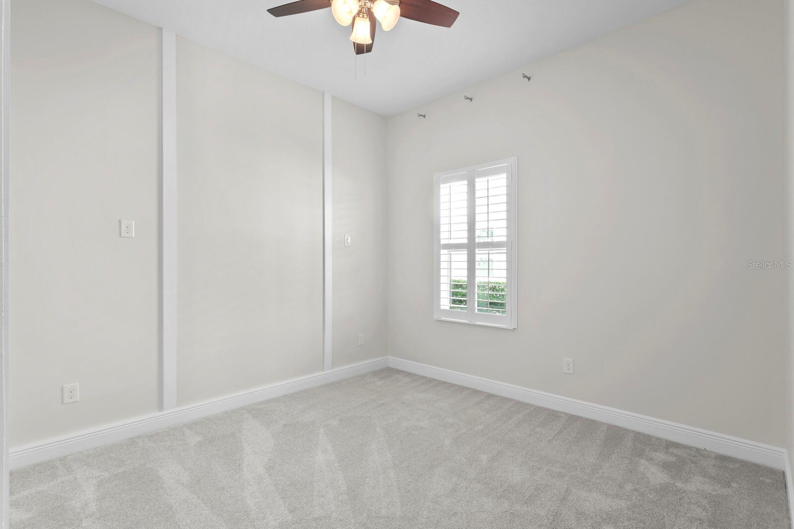 This other bedroom has neutral colors throughout