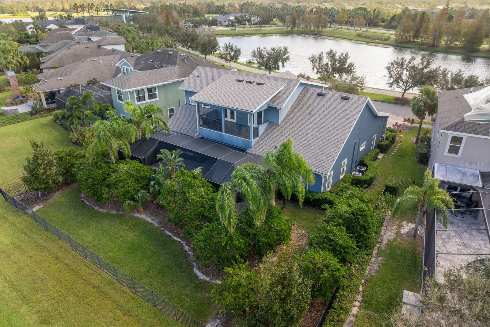 Mature landscaping in the fully fenced backyard