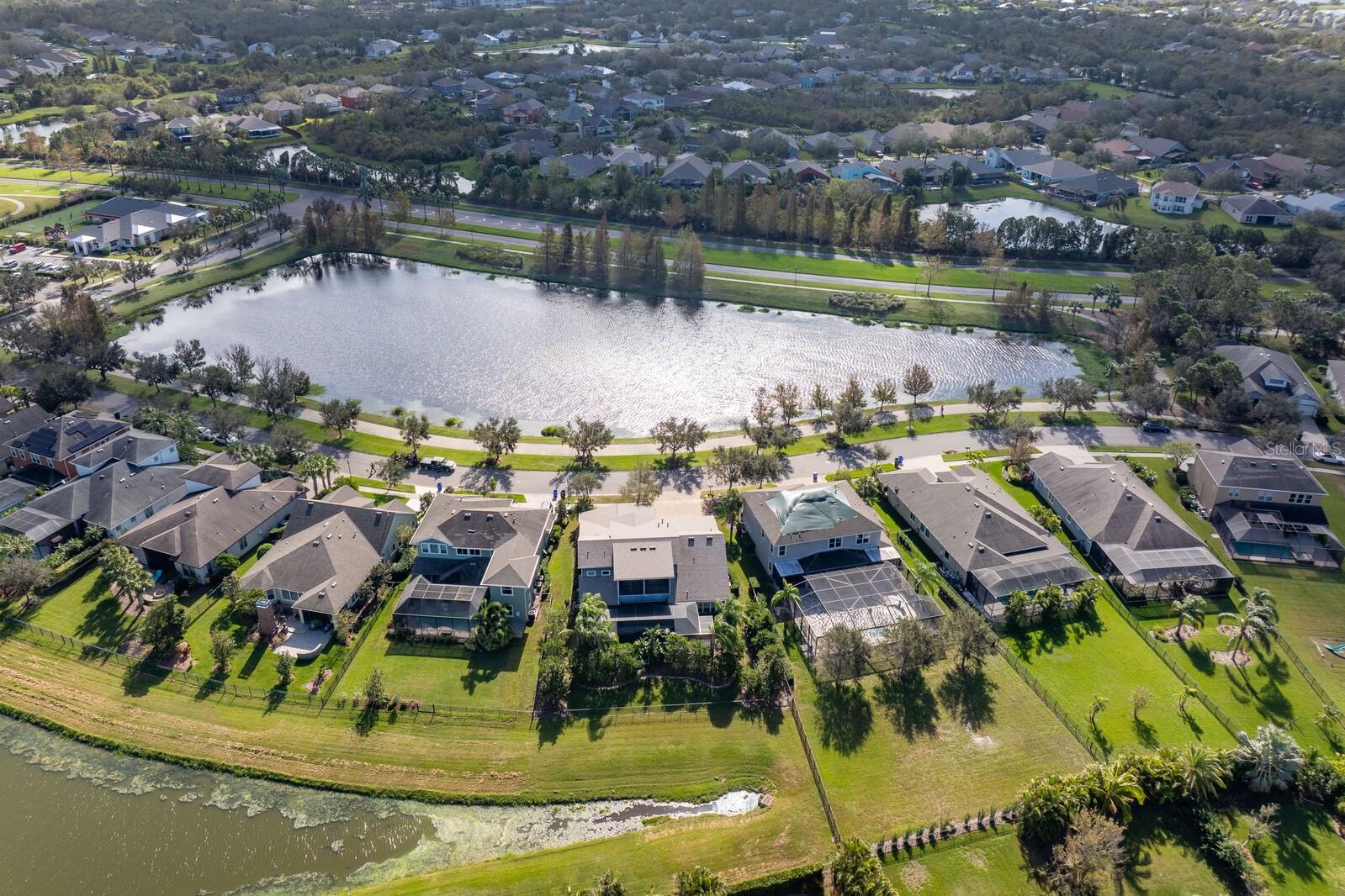 Aerial view of the home with southeast views of the community pond