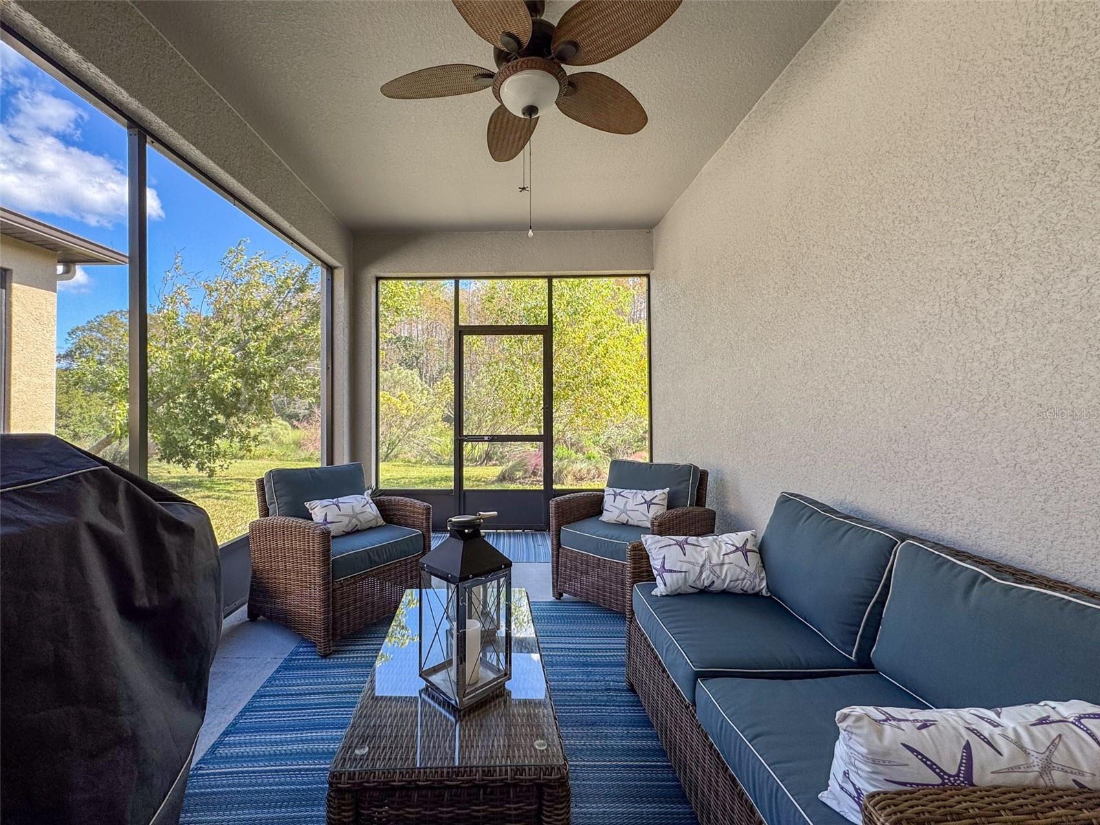 Screened In Rear Porch with view of pond