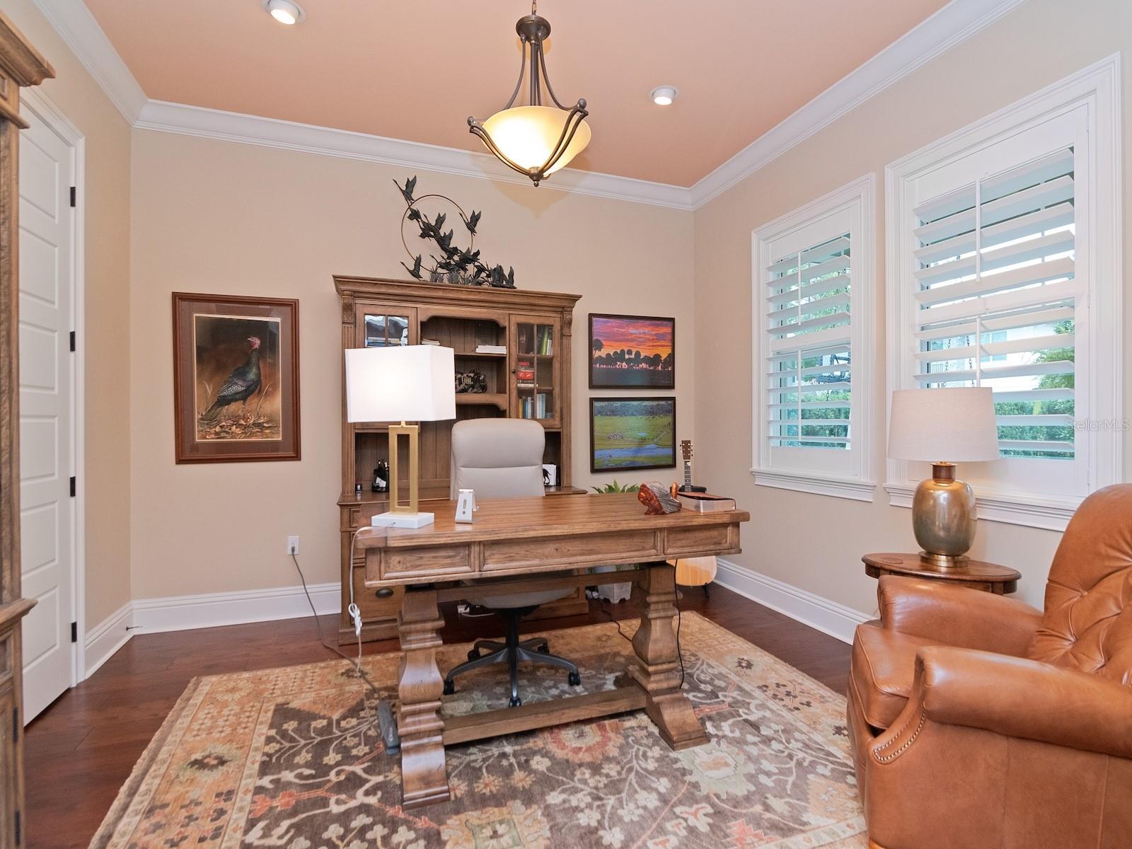 Living room easily functions as an office with double glass doors and walk in closet.