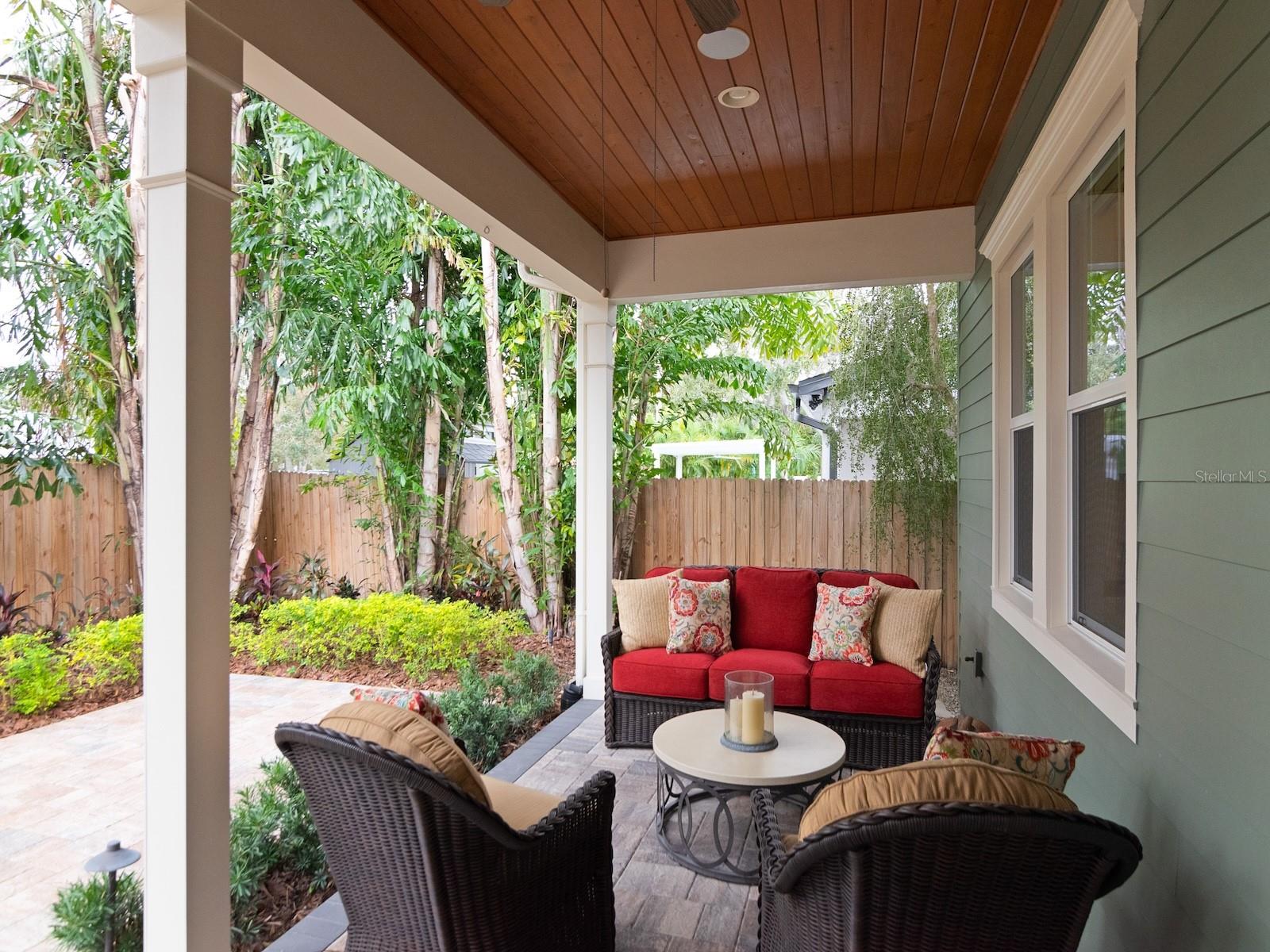 Spacious paver patio and lush landscaping.