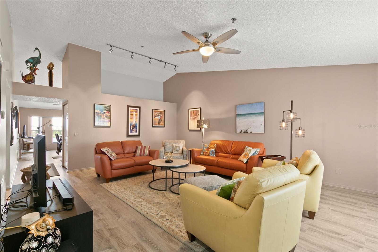 Living room boasts vaulted ceilings