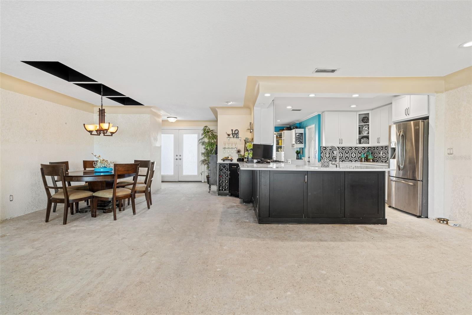 Living area looking into kitchen/dining area (toward entryway)