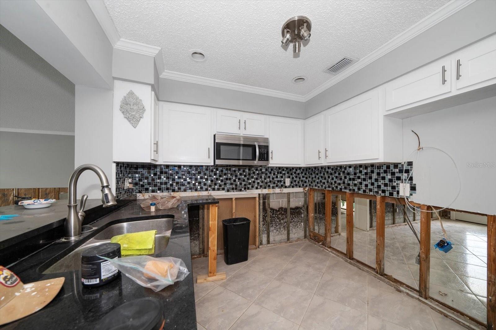 All new kitchen with granite counter tops. Damaged cabinets to be replaced. Drywall to be installed, textured and painted