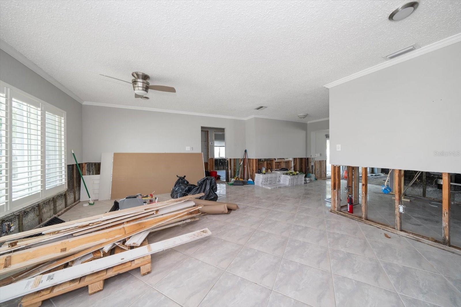 Living room with repairs in progress.  Drywall to be installed, textured and painted.