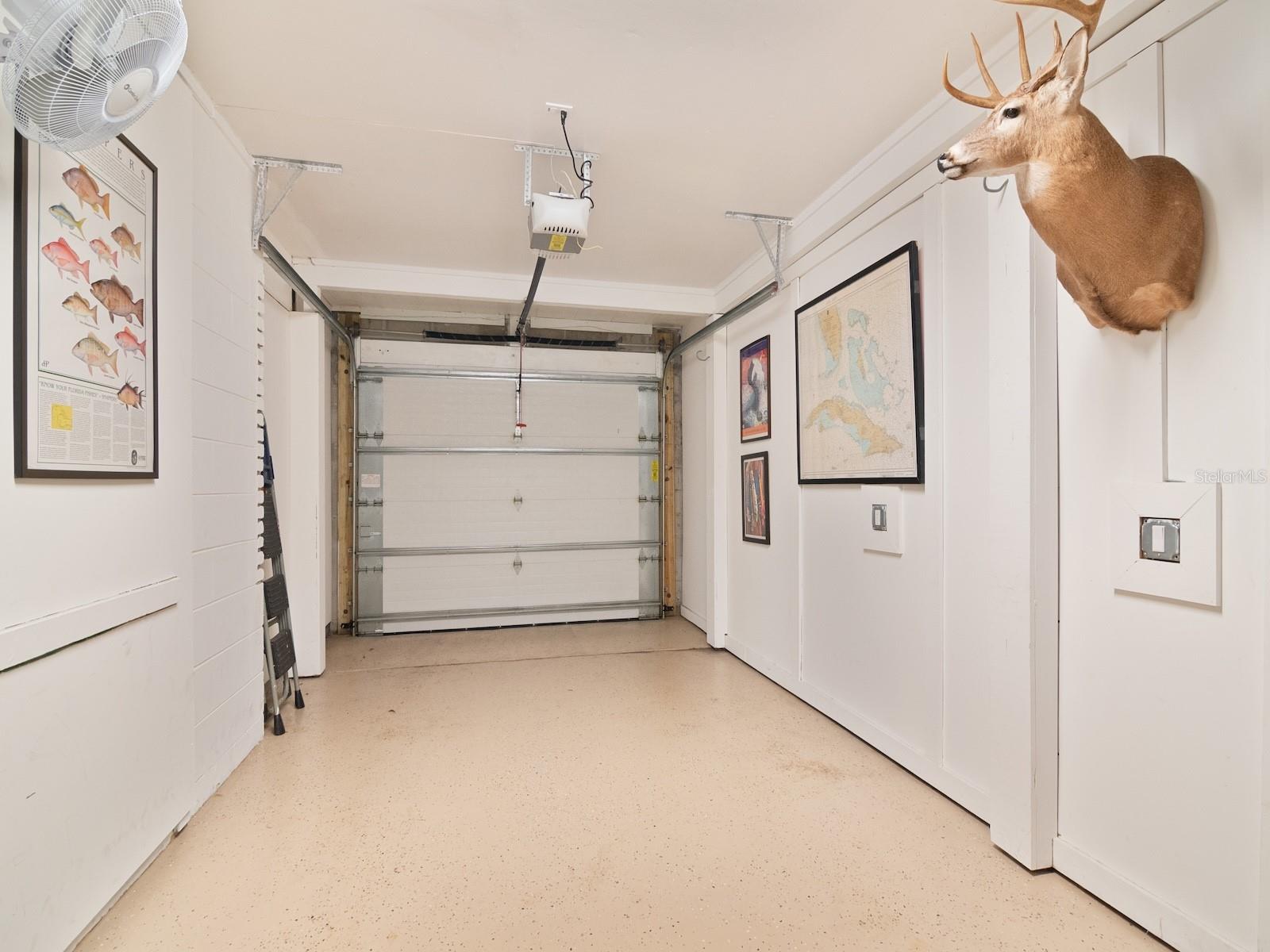 Hurricane rated garage door in this spotless garage.