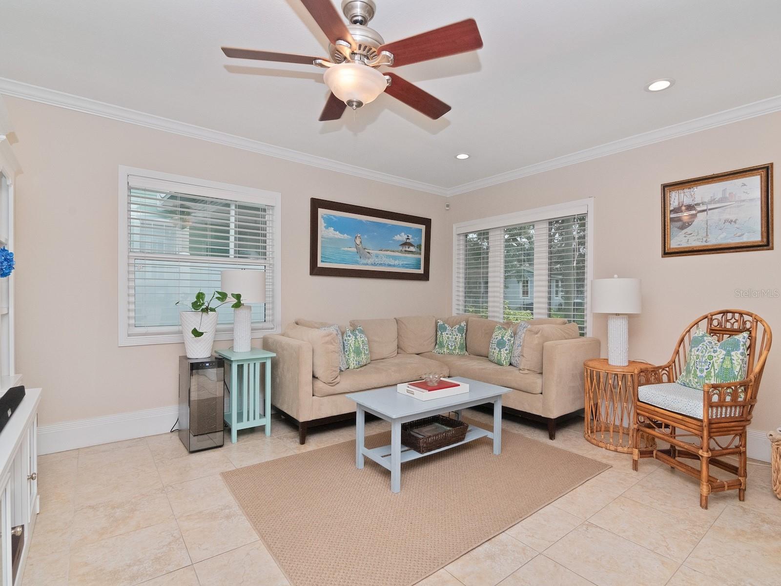 Spacious living room featuring hurricane impact rated windows (also throughout the entire home).