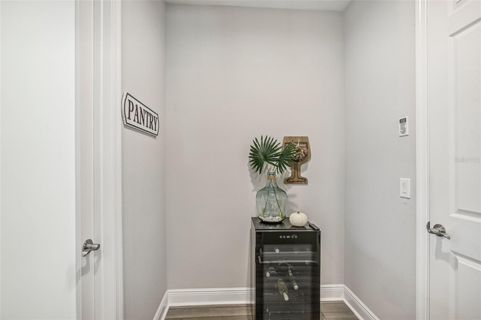 LARGE WALK-IN PANTRY OFF THE KITCHEN PROVIDES GREAT STORAGE