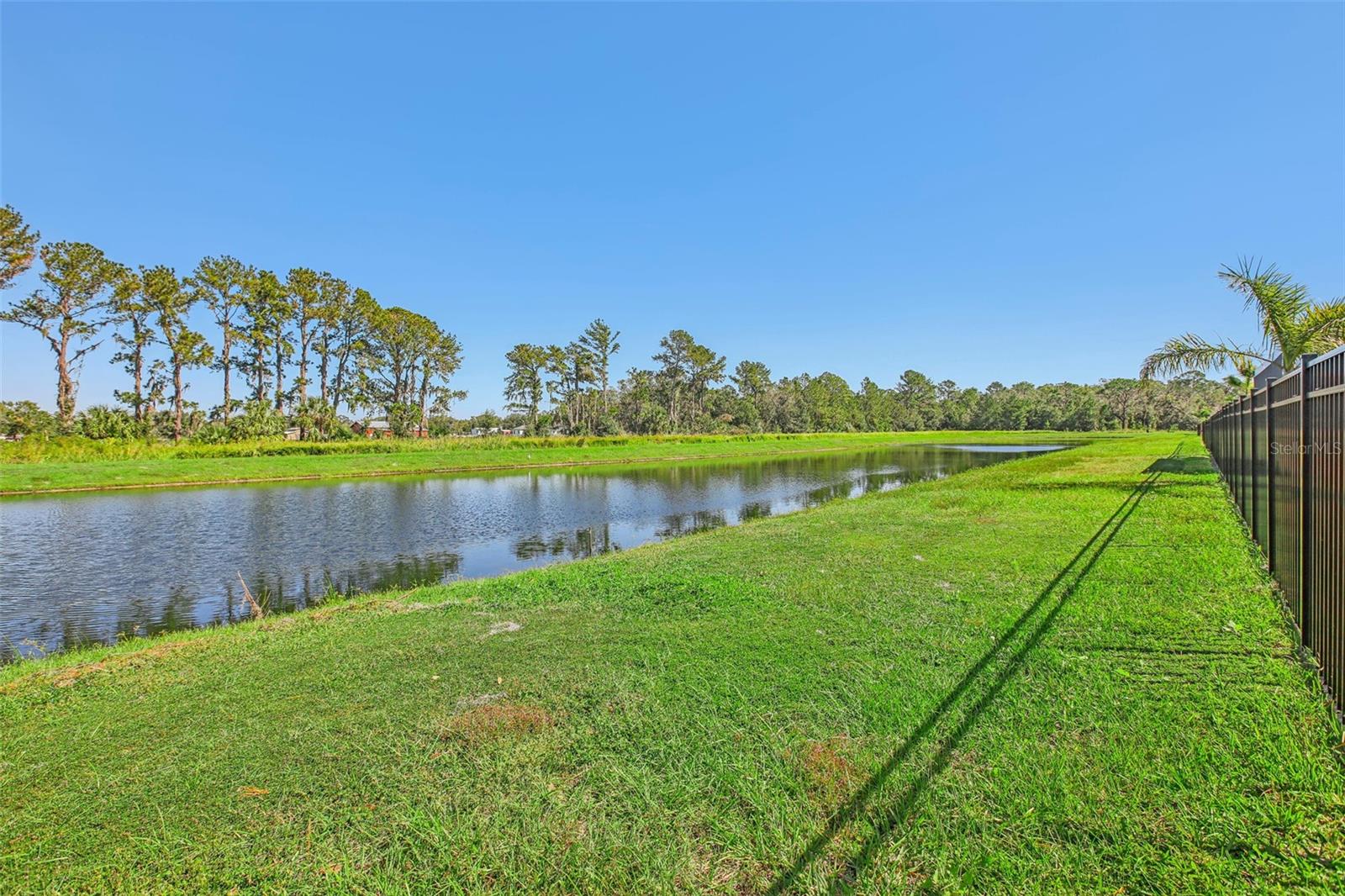 NESTLED ON A POND WITH NO BACKYARD NEIGHBORS!