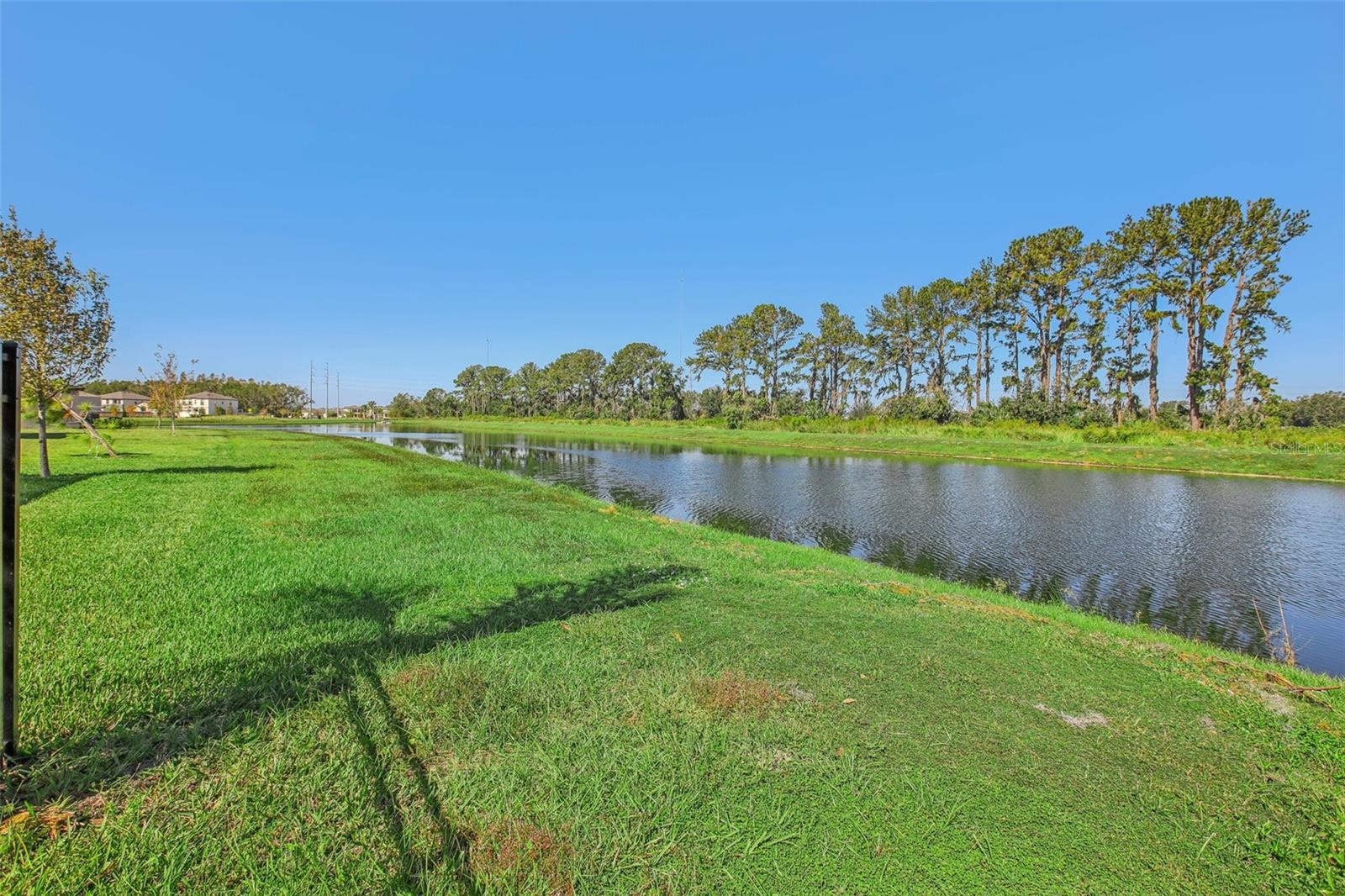 NESTLED ON A POND WITH NO BACKYARD NEIGHBORS!