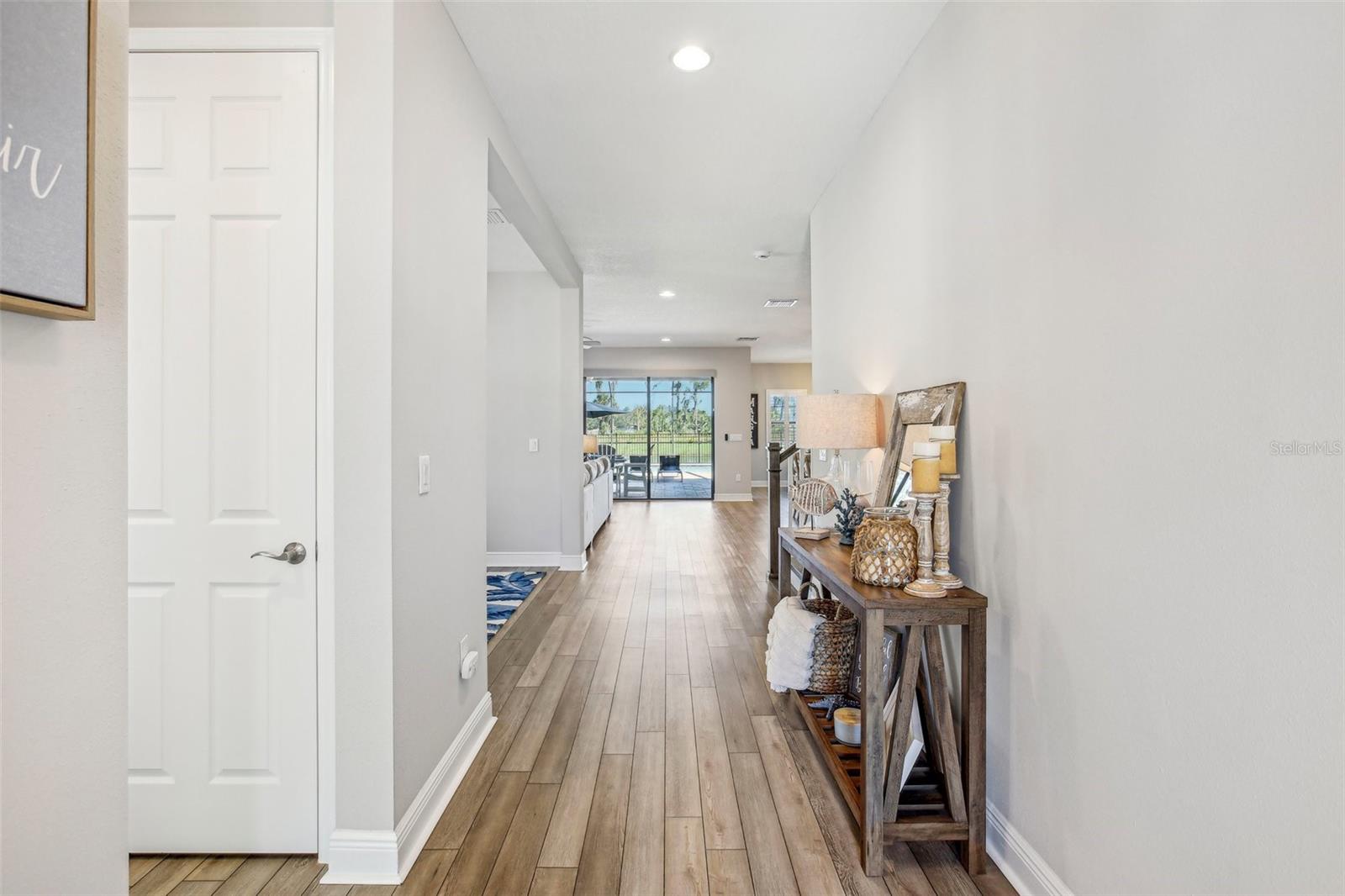 NEUTRAL PAINT AND HIGH CEILINGS GREET YOU IN THIS  BEAUTIFUL ENTRY HALL