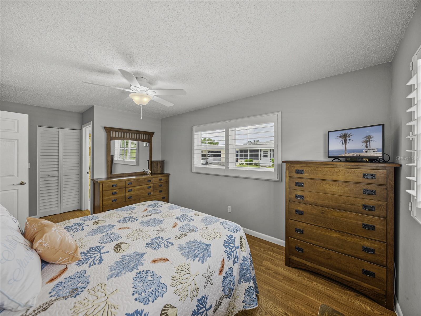 Note hurricane impact windows, plantation shutters, walk-in closet and lovely en-suite~