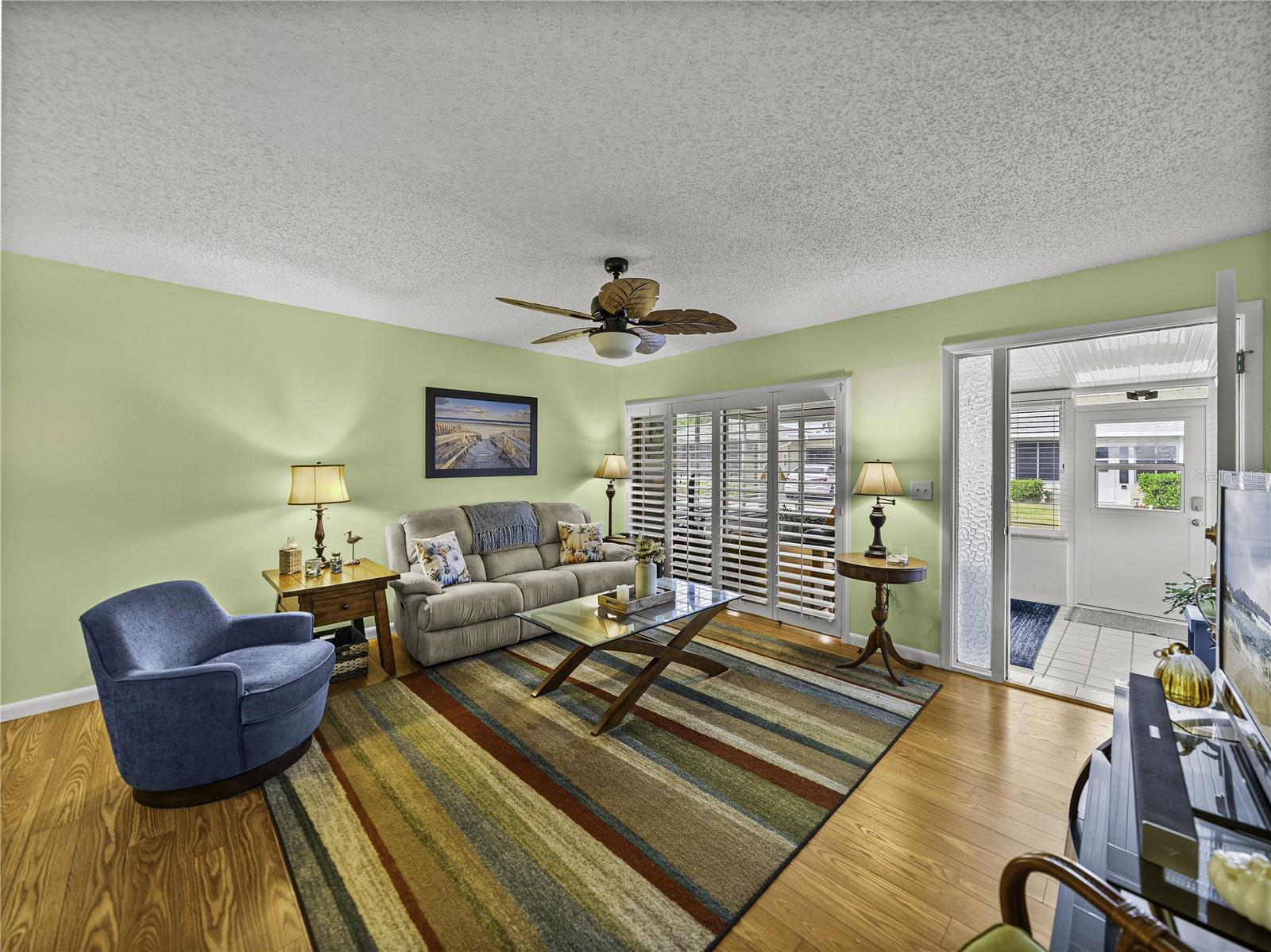 Neutral colors, plantation shutters, and an abundance of natural light throughout~