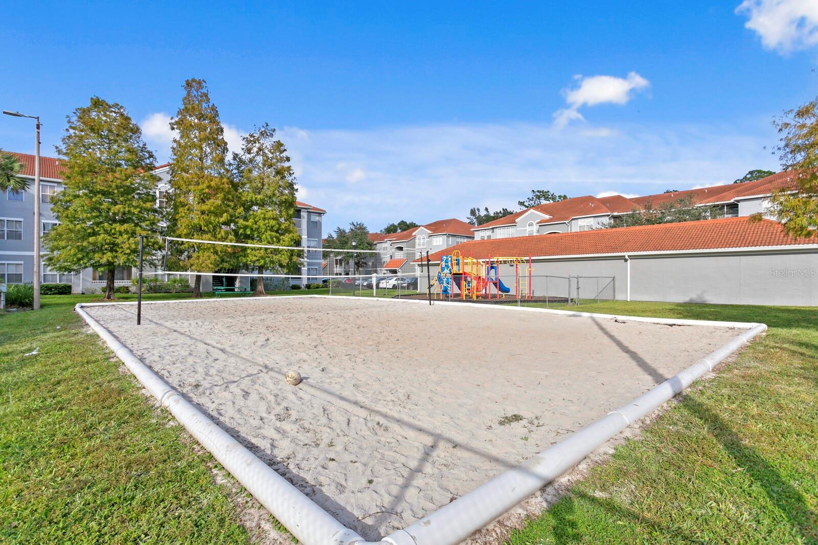 Communnity sand volleyball court and tennis court located just across from this unit