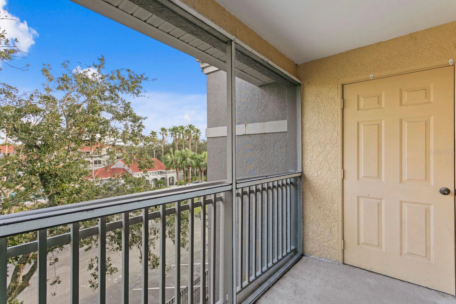 The screened lanai includes a storage closet