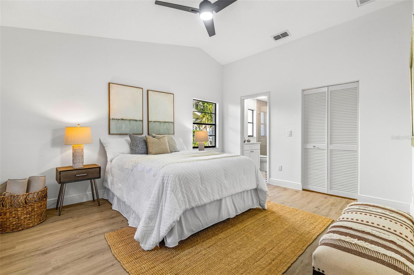 Primary bedroom with walk-in closet