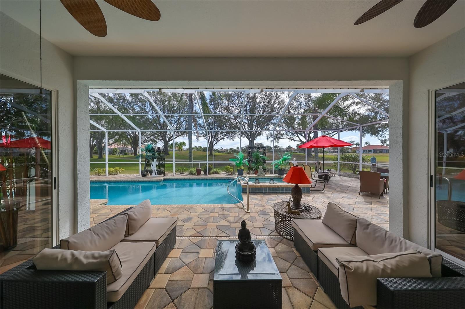 Covered Rear Lanai Custom Pavers, Outdoor Kitchen, Florida Screening