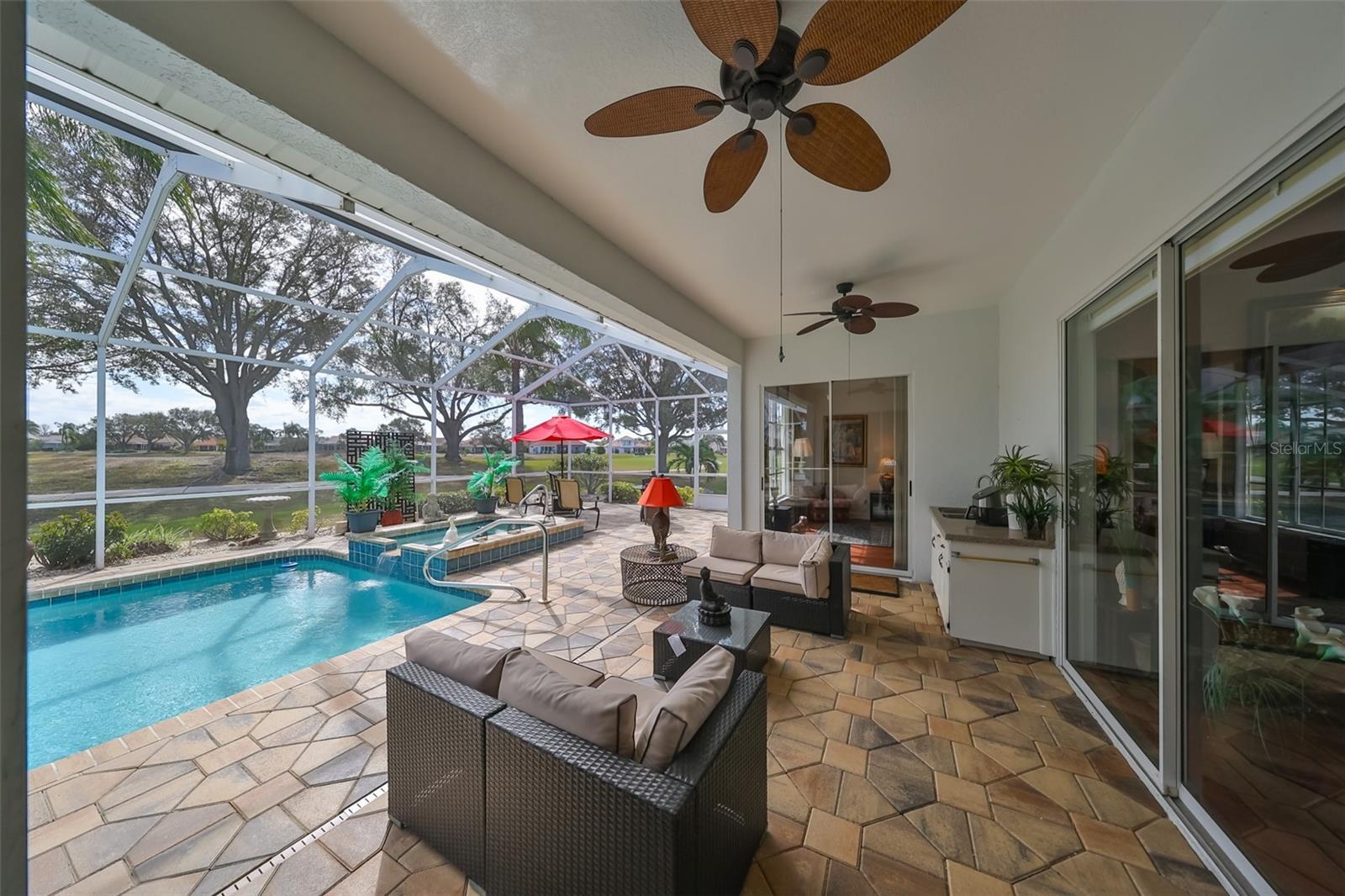 Covered Rear Lanai Custom Pavers, Outdoor Kitchen