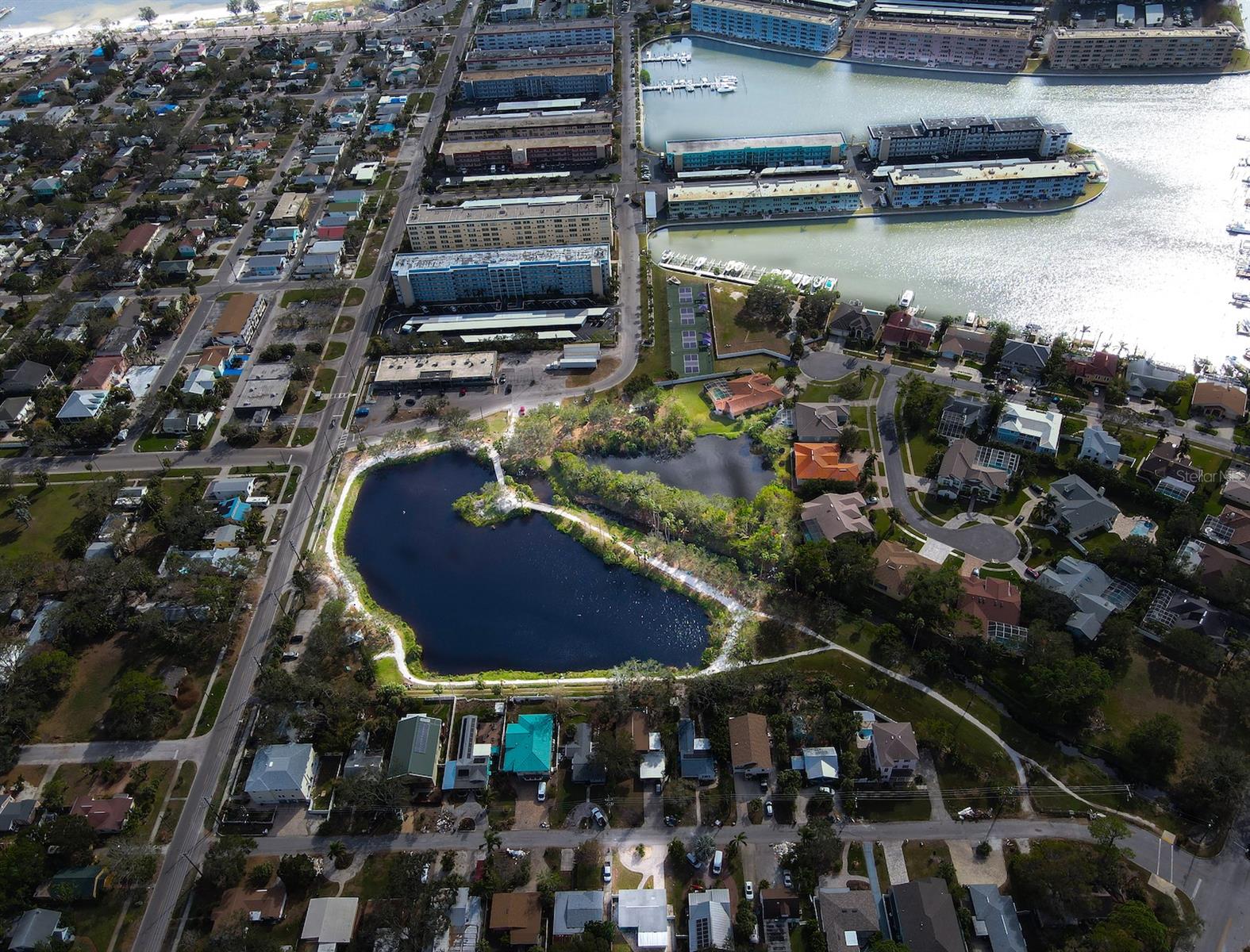 Aerial View of House with Wood Ibis Lake Park & Boca Ciega Bay