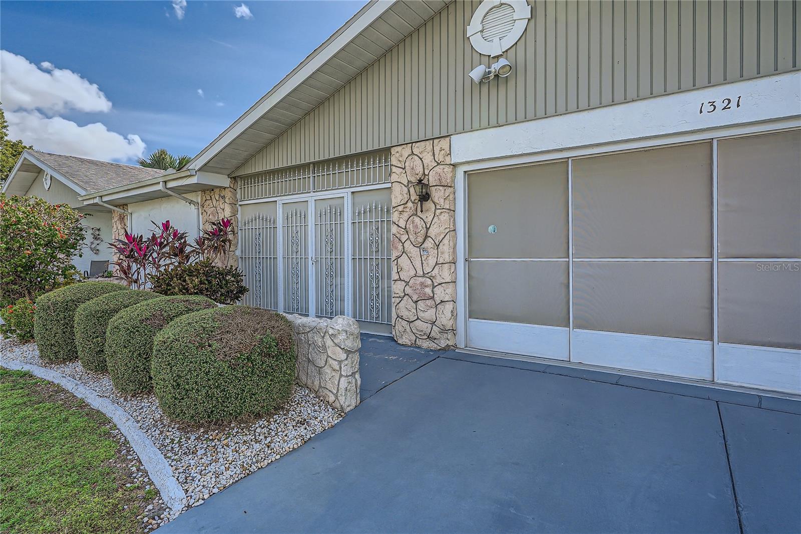 1321 Bluewater Drive with convertible screen garage and screened front porch