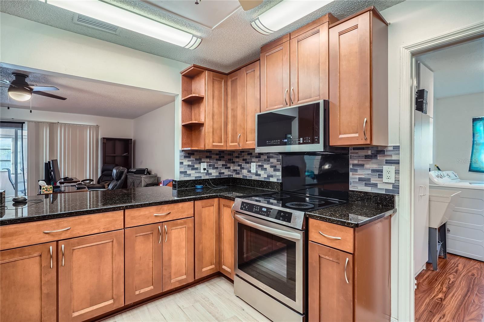 Updated Kitchen with view of laundry room at 1321 Bluewater Drive