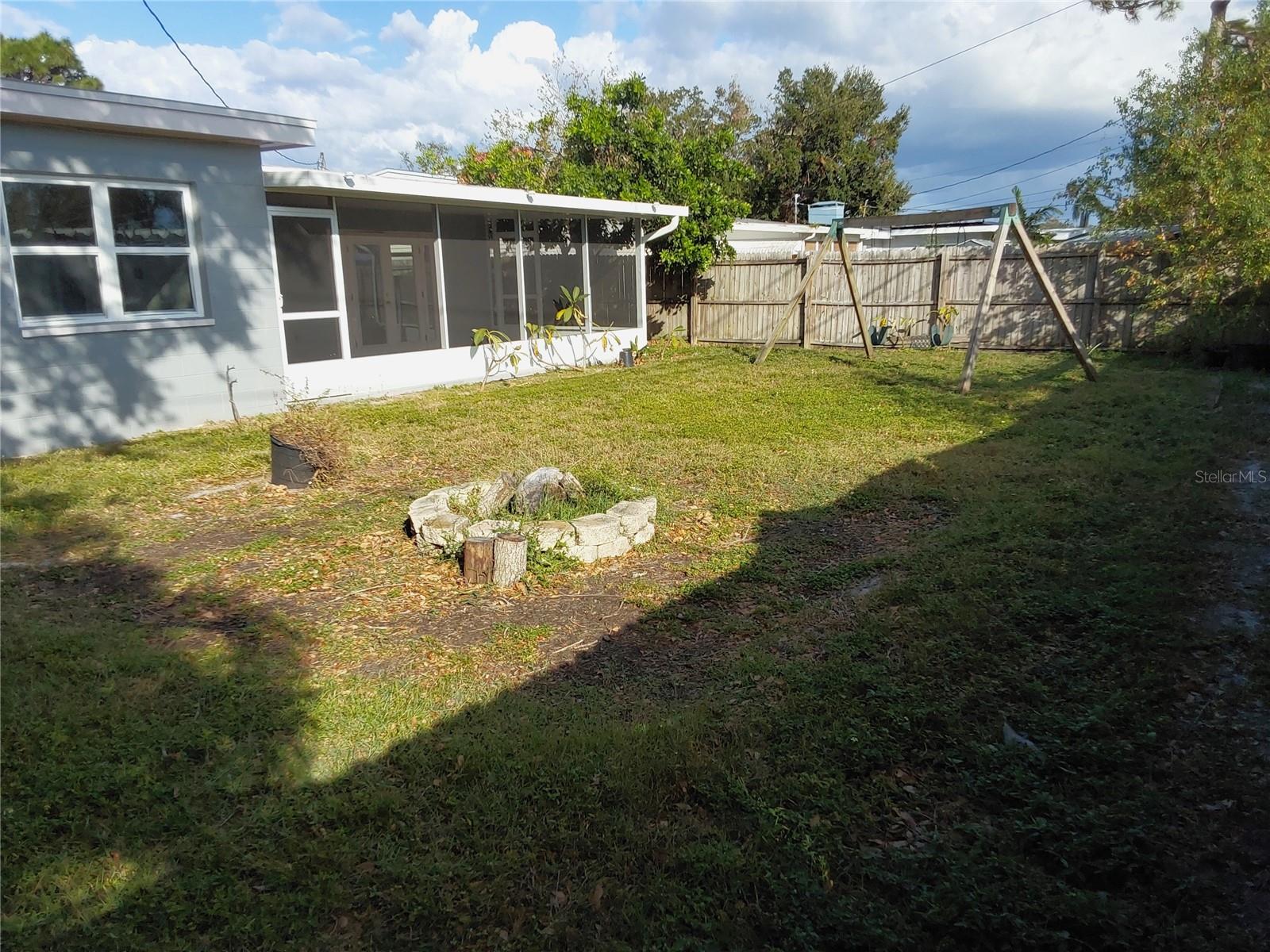 Backyard with Firepit and room for garden facing South.