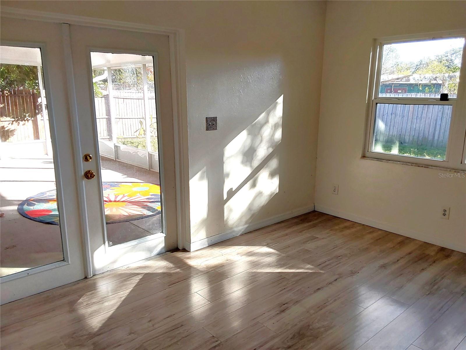 Light and Bright with French doors to patio.