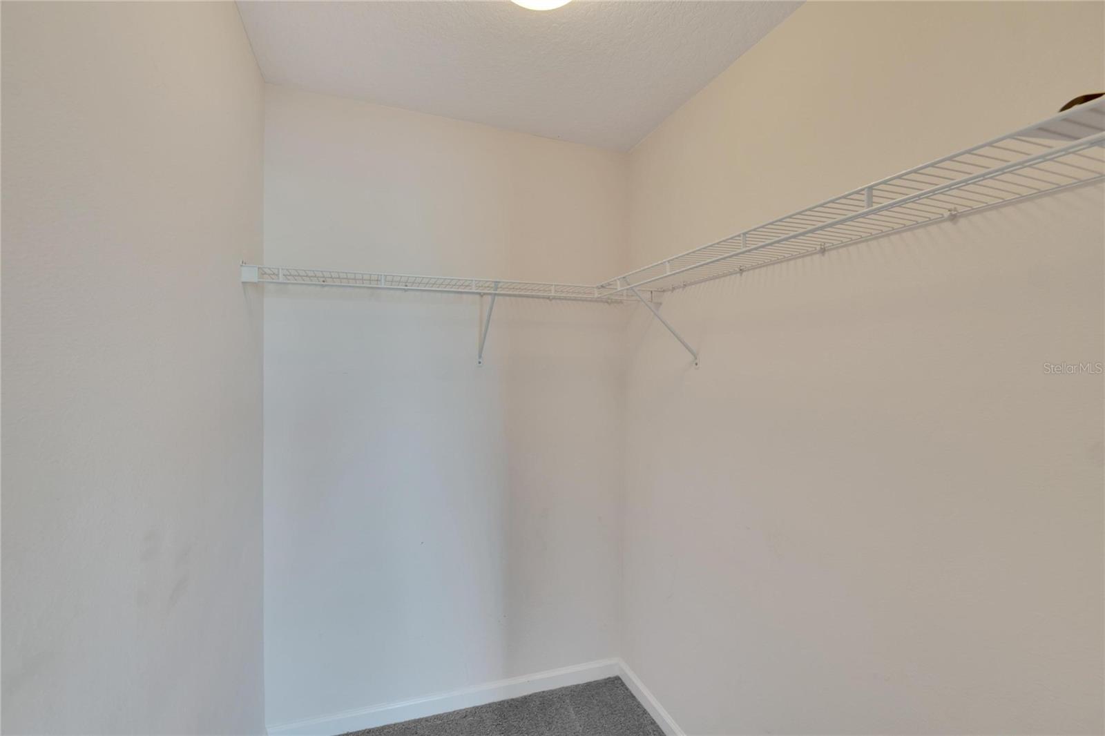 Large walk in closet in secondary bedroom