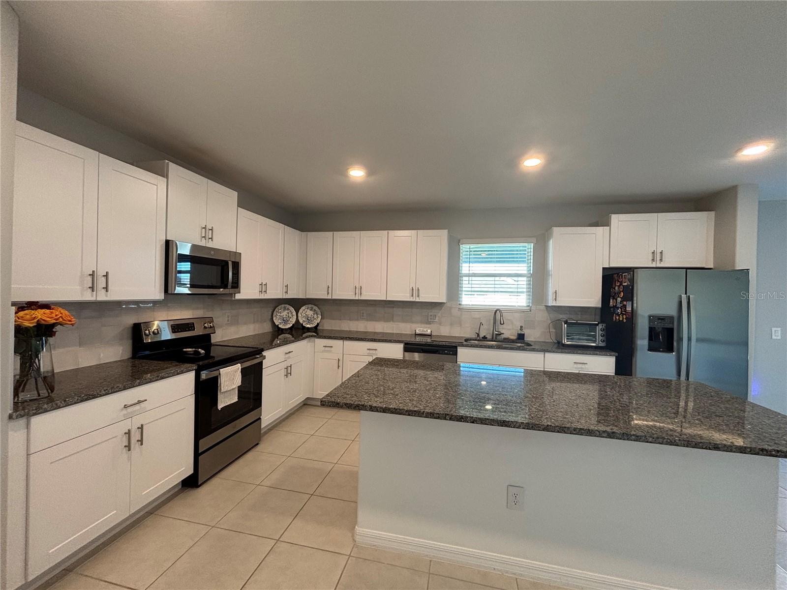 Added handmade tile backsplash
