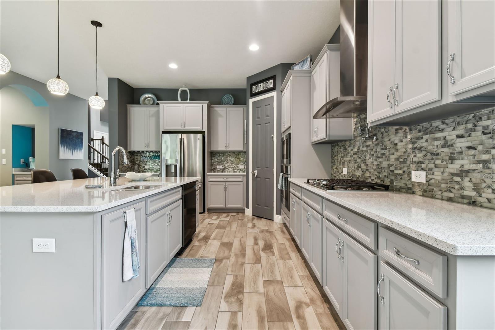 Kitchen w/Pendant Lights & Gorgeous Backsplash