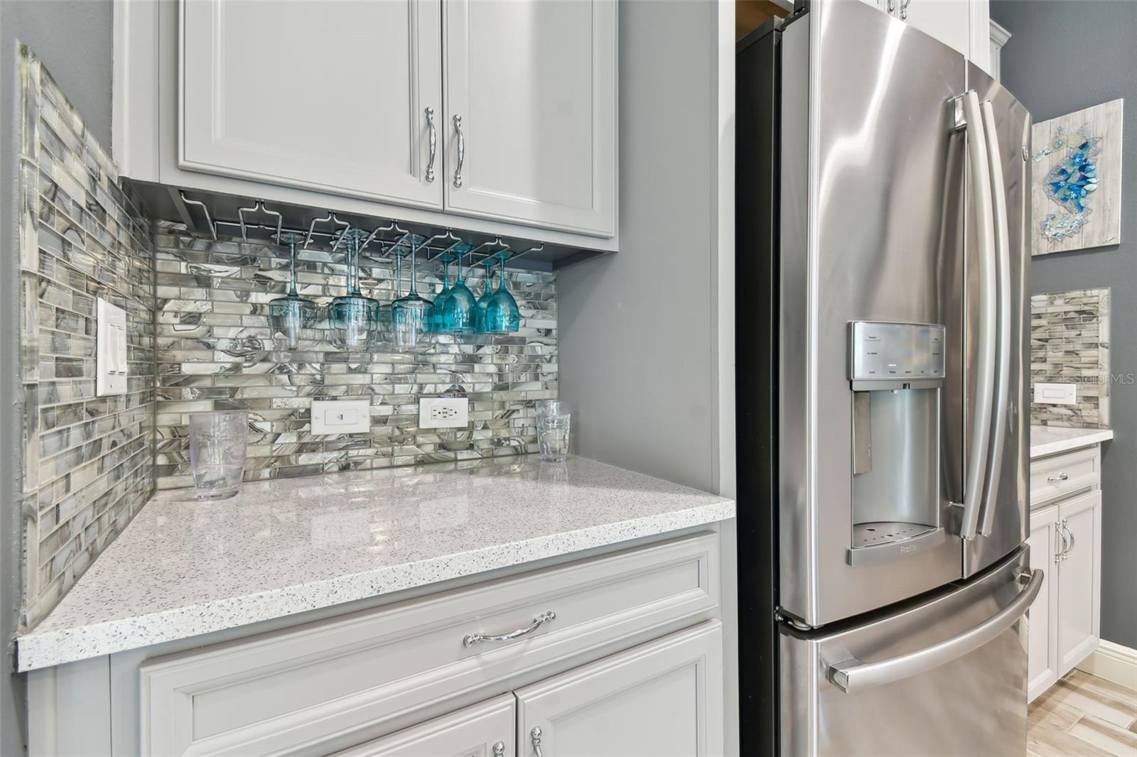 Kitchen w/Beautiful Backsplash & Wine Glass Rack