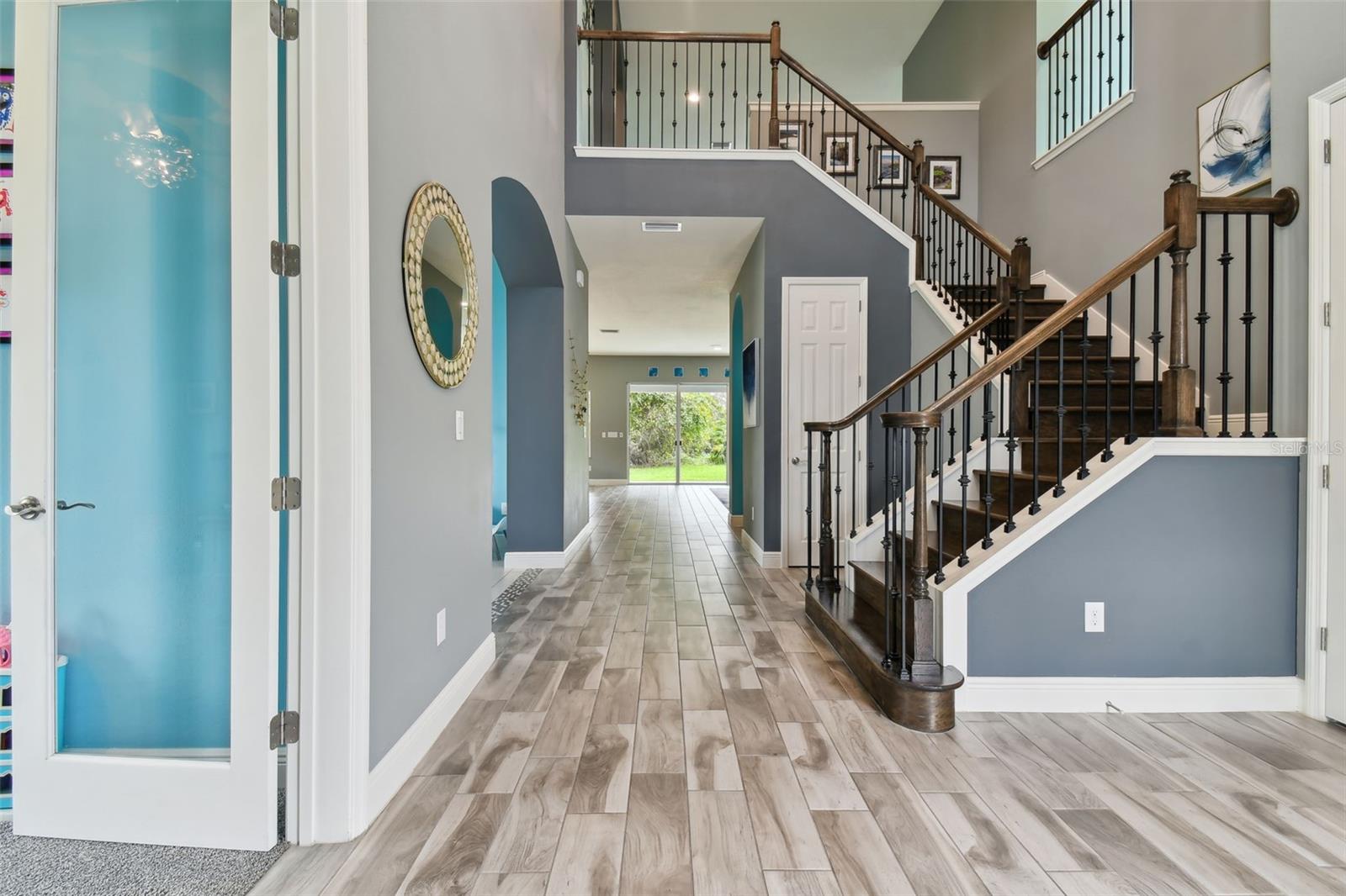 Foyer & Stairway w/Wrought Iron Spindles