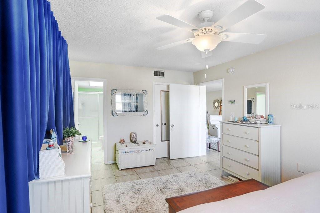 Primary Bedroom with view of bathroom and walk in closet