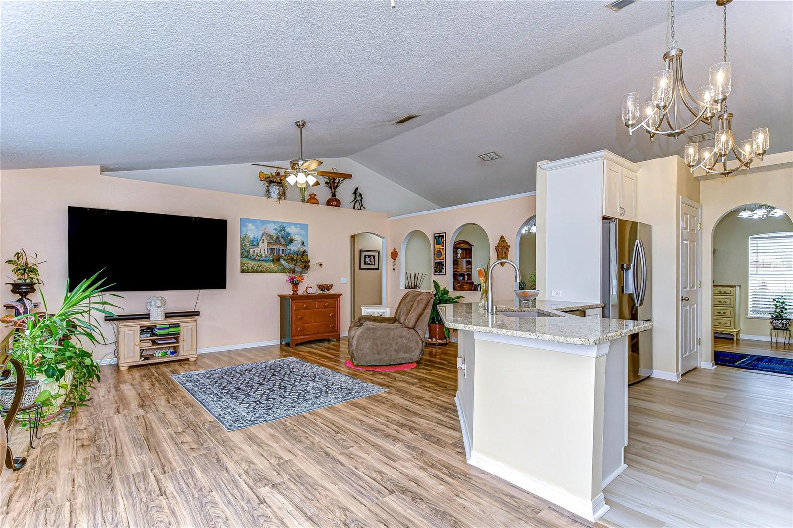 Interact from the kitchen with your family and guests in this open floorplan.