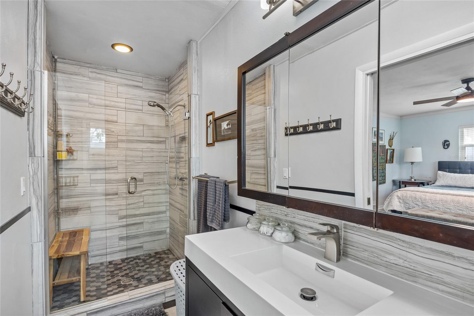 Floor to ceiling tile on the walls and a frameless glass shower door really define this luxury bathroom!