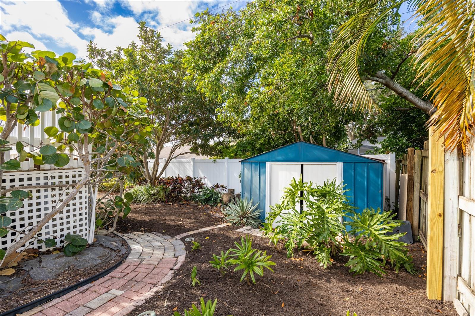 A storage unit in the rear corner provides some extra space for yard tools and such.