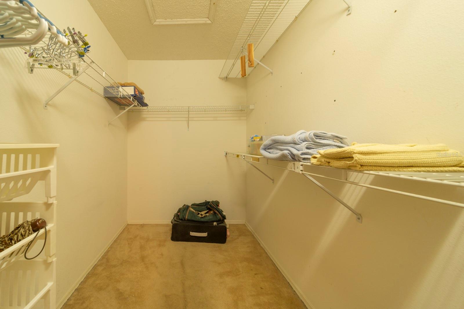 Walk in closet in primary bedroom