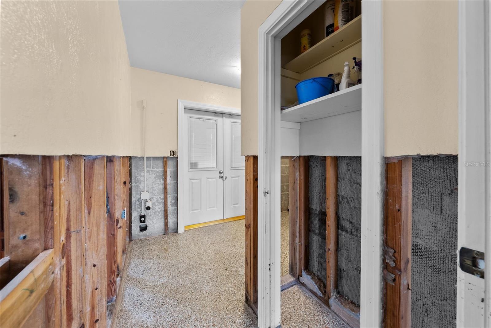 Entrance to Laundry Room - Doors lead to Carport