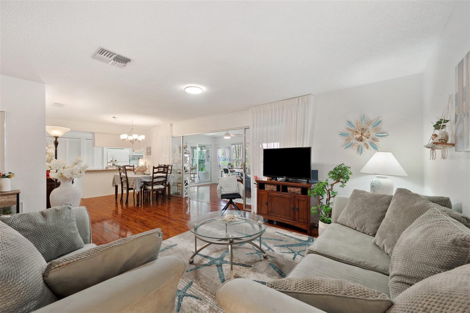 Living Room and Dining Room overlook the huge Florida Room